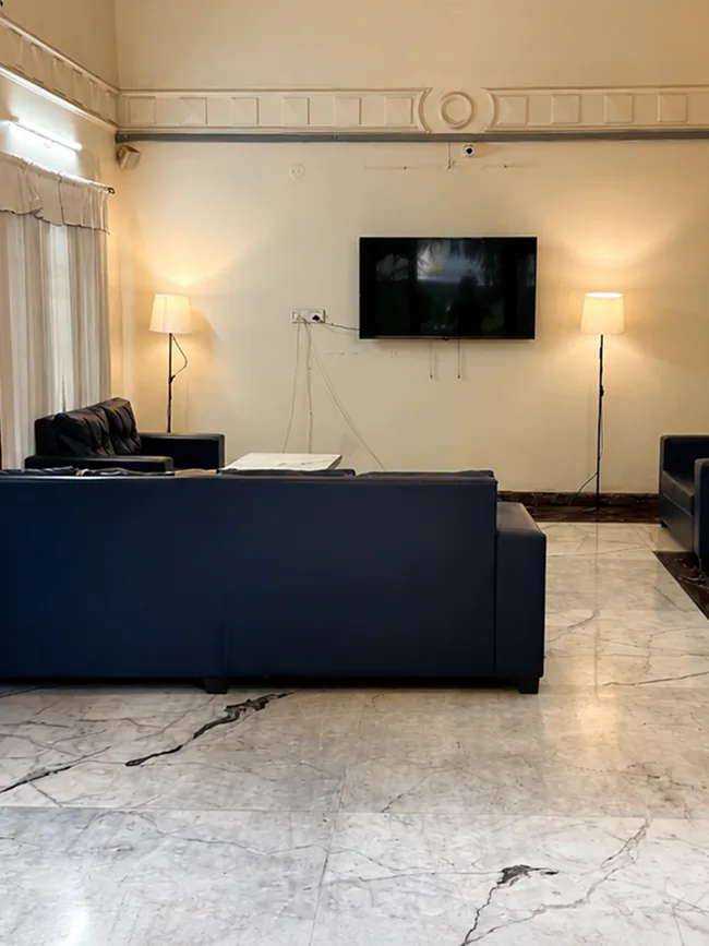 Comfortable lounge area with TV at Pune Centre Hostel