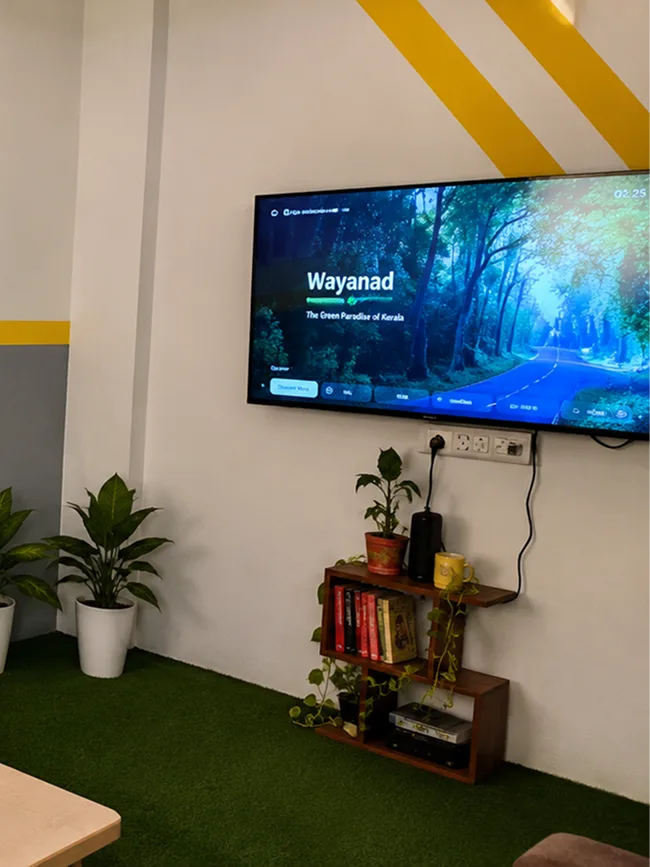 Recreation and TV room with plants at Pune Centre Hostel